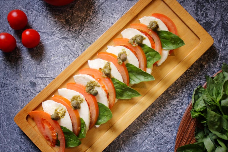 Caprese garden salad with tomatoes and fresh mozzarella